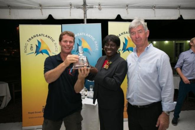 Laurent Pellecuer (left) collects a RORC decanter for winning IRC One for the crew who are all surgeons and raced across the Atlantic for the first time on the Class40, Seconde Chance. Middle: Dr. Clarice Modeste-Curwen, Minister for Tourism, Civil Aviation, Culture and Cooperatives, Right: Eddie Warden Owen, Chief Executive of RORC - RORC Transatlantic Race © RORC/Arthur Daniel